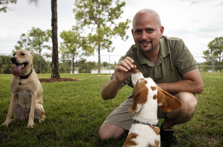 Eddie Stephens wirh his dogs Jack Henry and Abigail Sowflake at Okeeheelee Dog Park.